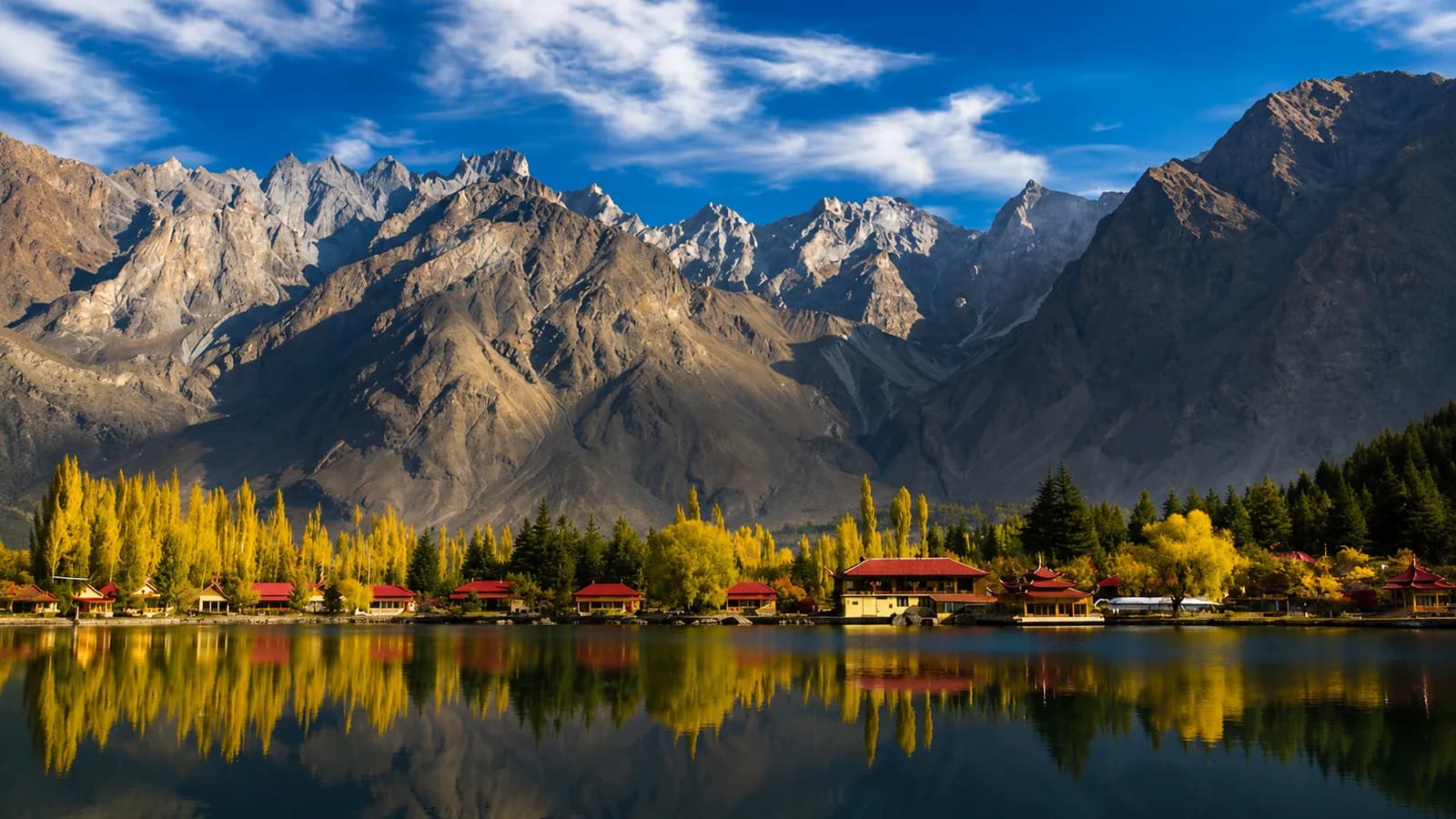 The red-roofed resort on Lower Kachura lake near Skardu, with autumn colour along the shore